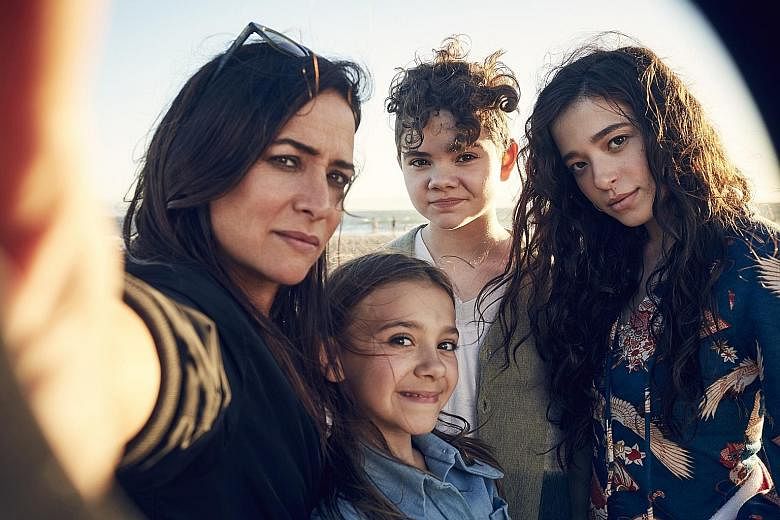 Pamela Adlon's character in Better Things has to juggle a demanding mother, a distant ex-husband and three headstrong daughters, played by (from far left) Olivia Edward, Hannah Alligood and Mikey Madison.