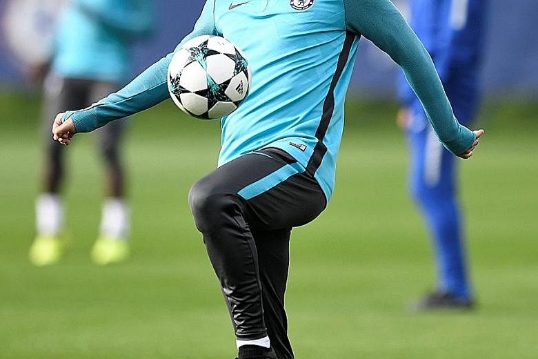 Chelsea's Eden Hazard training in London ahead of their trip to Madrid to face Atletico in the Champions League tonight. While he feels that not every player should have to defend as everyone has a specific role, he understands that tracking back is 