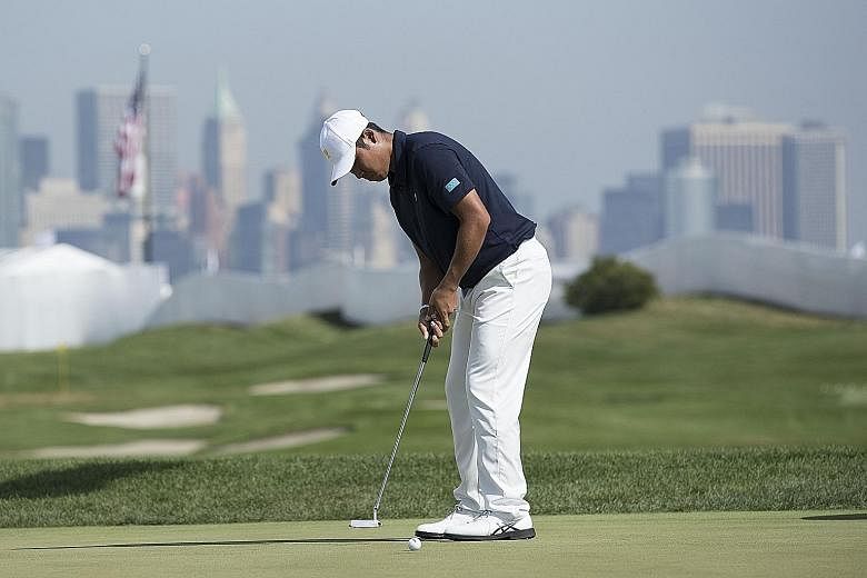 International golfer Hideki Matsuyama practising on the putting green at Liberty National. He is the team's best ranked at world No. 3.