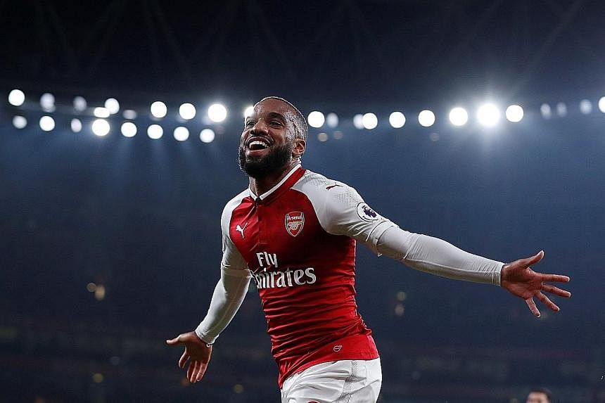 Alexandre Lacazette celebrating after scoring Arsenal's first goal, before netting from the spot to make it four goals since his close-season move from Lyon.