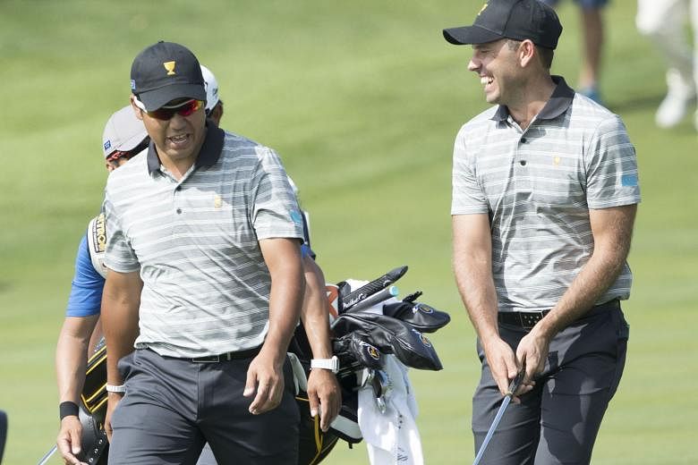 Japan's Hideki Matsuyama sharing a light moment with South African Charl Schwartzel at the Liberty National Golf Course ahead of this year's Presidents Cup.