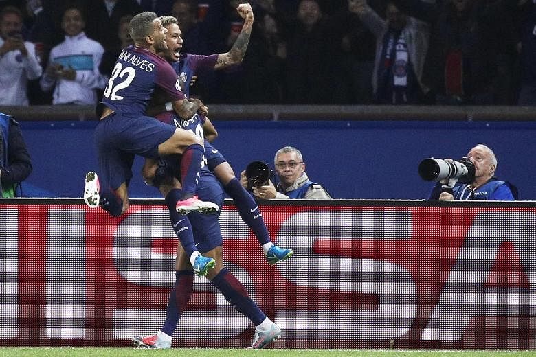 Record signing Neymar celebrating his goal and PSG's third against Bayern Munich with Dani Alves and Kylian Mbappe at the Parc des Princes on Wednesday. The German giants had no answer to PSG's much-vaunted "MCN" attacking trident.