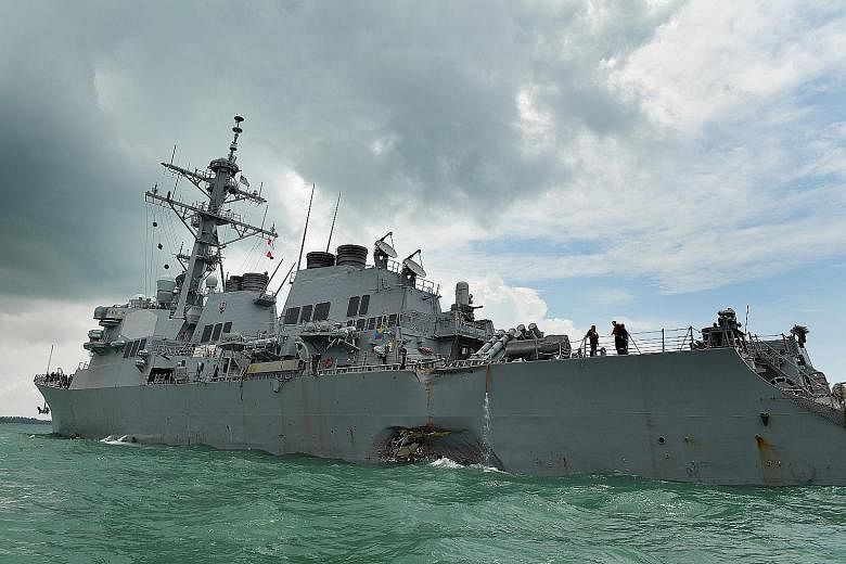 The USS John S. McCain after the collision with a tanker on Aug 21, which left its left side near the stern damaged. The ship, berthed at Changi Naval Base since the accident, will leave Singapore for Yokosuka, Japan, some time next month