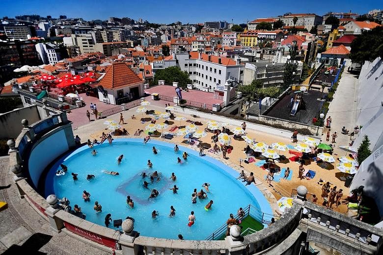 Leisure with views: Lisbon's Torel public pool (above) and a movie screening on the terrace of the Topo Chiado bar and restaurant.