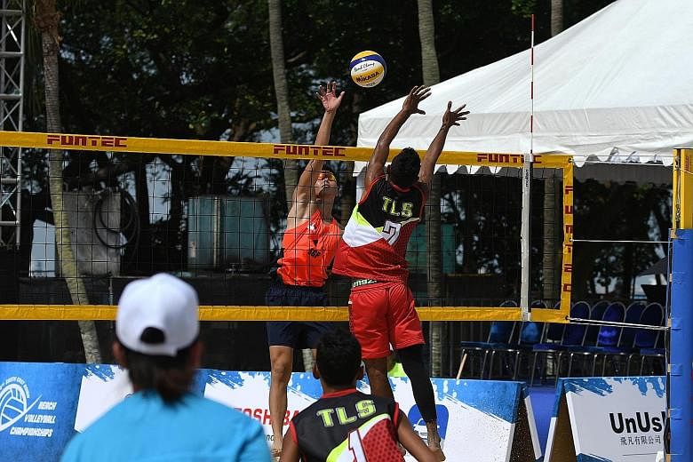 Singapore's Poon Pei Jie and Timor Leste's Jean da Silva facing off at the net during their pool-stage clash at the South-east Asian Beach Volleyball Championships on Sentosa's Palawan Beach on Thursday. Poon and Mark Shen lost in the quarter-finals 