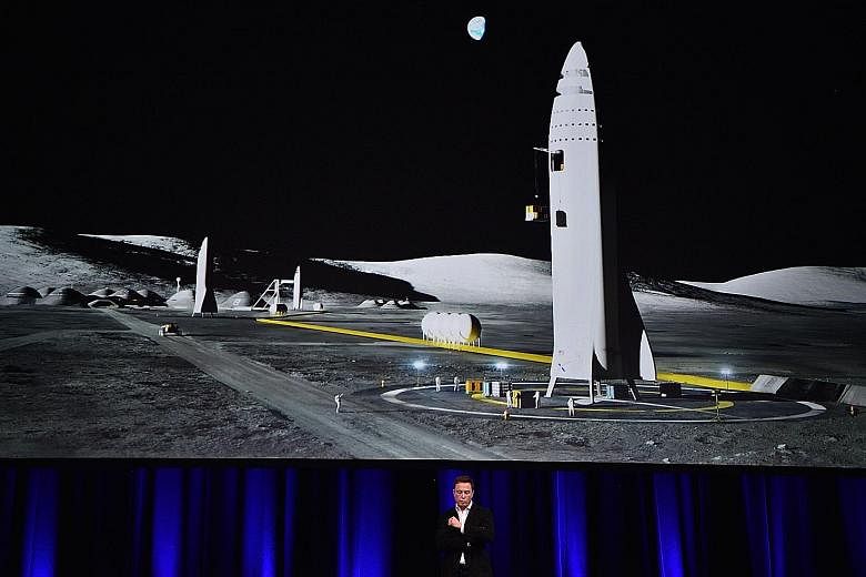 Mr Elon Musk with an illustration of his rocket, which he says will be completed and launched in about five years.