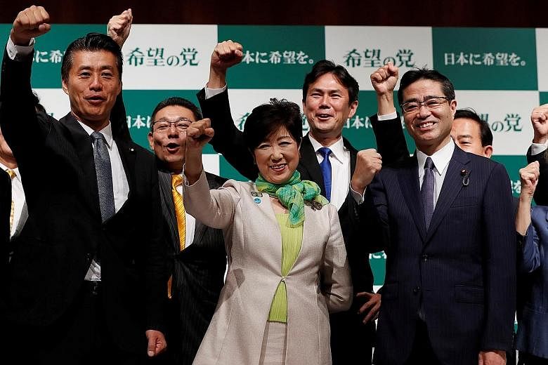 Ms Yuriko Koike, with members of her Party of Hope, at a news conference to announce its campaign platform last week.