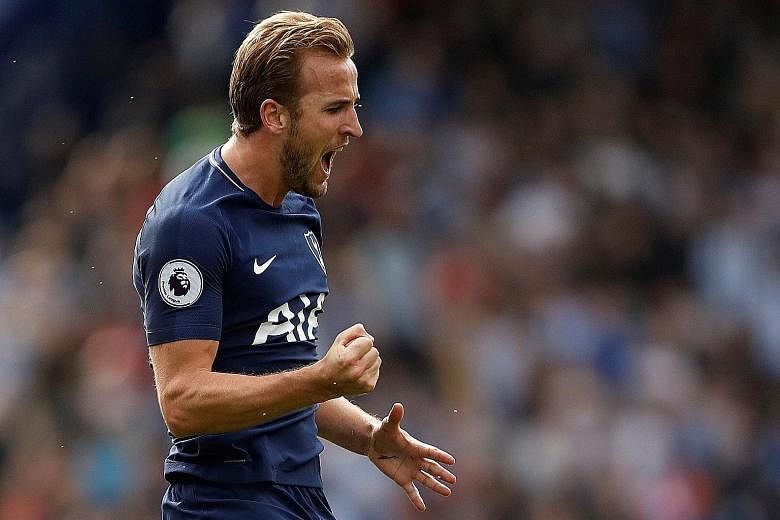 Tottenham's Harry Kane celebrates scoring their third goal at John Smith's Stadium. He also scored the opening goal in their 4-0 spanking of Huddersfield.