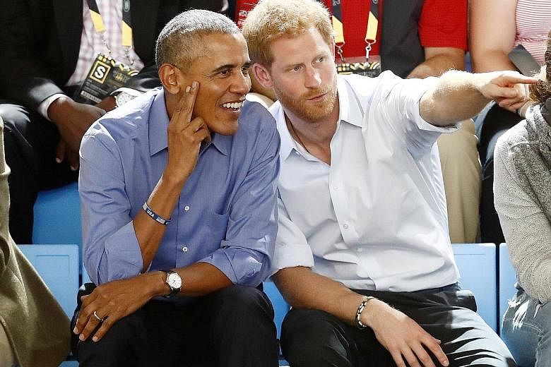 Britain's Prince Harry watching a wheelchair basketball event with former United States president Barack Obama at the Invictus Games in Toronto, Canada, last Friday. The Invictus Games, the brainchild of Prince Harry, is an international Paralympic-s