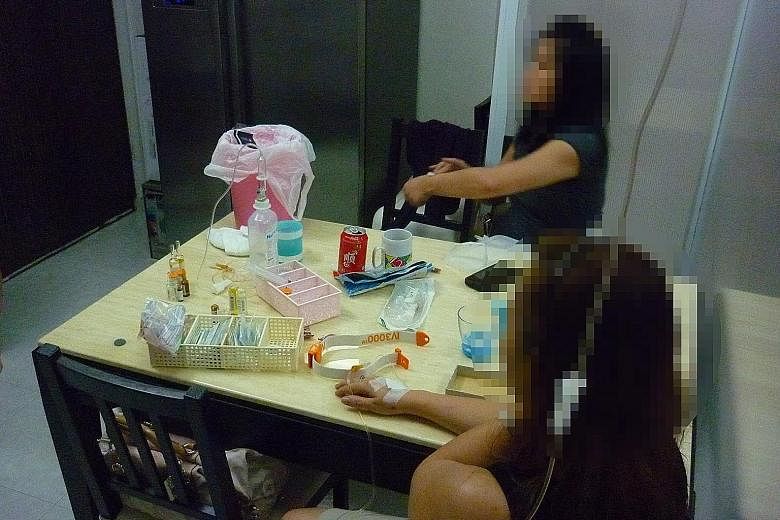 Top: Clients receiving a drip of whitening solutions at a blogger's makeshift beauty salon. Above: Sexual enhancement pills seized by HSA from the home of a man, who was jailed for 18 weeks.