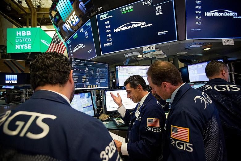 Traders on the floor of the New York Stock Exchange. US equities set a new high last Friday, with both the S&P 500 and Nasdaq rising to uncharted territory on renewed hopes that President Donald Trump will get his way in legislating for a big cut in 