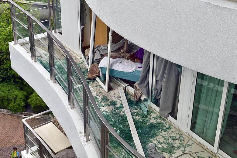 The shattered remains of glass doors and windows of the fifth-floor Cote D'Azur apartment's balcony. The incident is believed to have involved the rupture of a storage water heater.