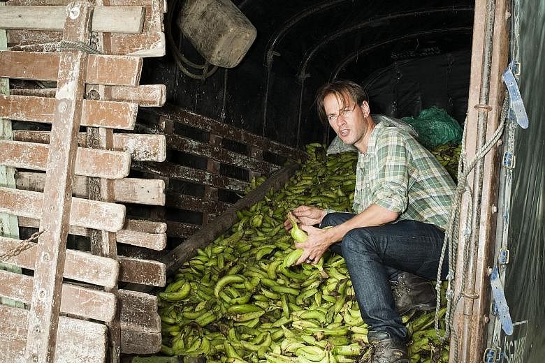 Food-waste campaigner Tristram Stuart examines a pile of bananas in Colombia that has been rejected by European supermarkets.