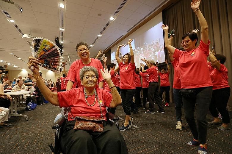 Madam Chan Ah Peng (in wheelchair), 80, taking part in a dance performance with others from O'Joy Care Services yesterday.