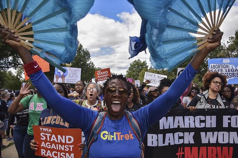 Two separate rallies converged on the weekend in Lincoln Park, a picnic-and-birthday-party plot nestled in the heart of the gentrified eastern part of the Capitol Hill neighbourhood in Washington. 	Thousands of anti-racism marchers rallied last Satur