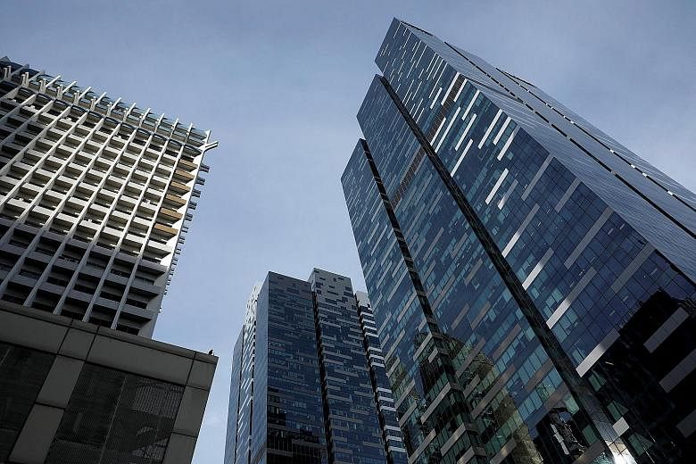 The $2.09 billion sale of Asia Square Tower 2 (far right), along with a bumper $1.622 billion bid for a Beach Road site last week, has sparked renewed interest in a commercial property market that is already bubbling away.
