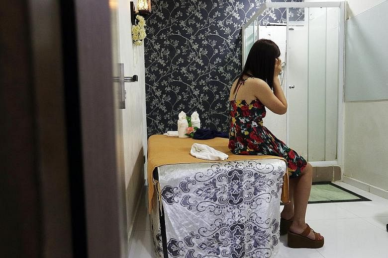 A police raid of unlicensed massage parlours, including this one at Upper Paya Lebar, in April this year. There has been a 40 per cent increase in the number of unlicensed massage outlets here between 2013 and last year.