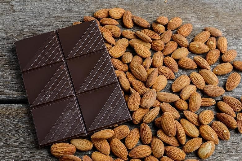 Dark chocolate contains flavanols, which may lower blood pressure and improve blood flow to the brain and heart. Almonds are also good for the heart.