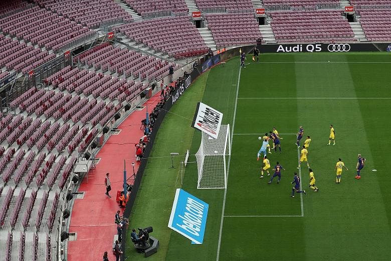 Barcelona's Sergio Busquets heading in the opener against Las Palmas on Sunday. The LaLiga game was played in an empty Camp Nou in protest at the violence surrounding the Catalan independence referendum.
