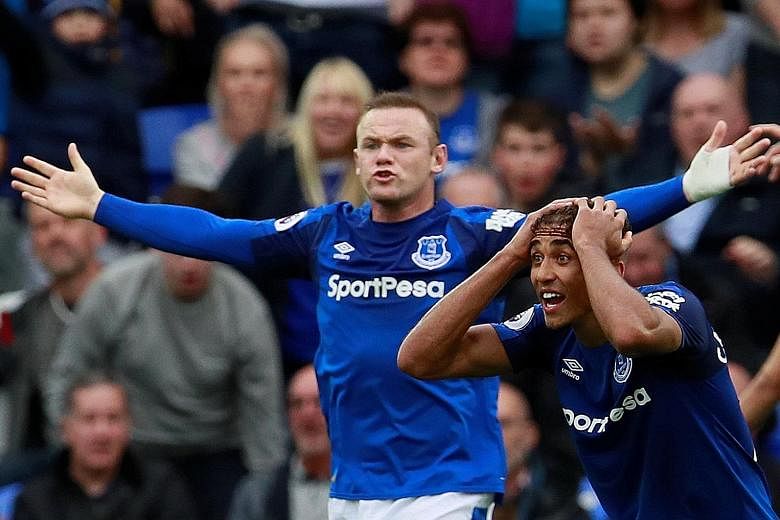 Everton's Wayne Rooney and Dominic Calvert-Lewin appealing in vain for a penalty during the home loss to Burnley. The Toffees are in 16th place, two points above the drop zone.