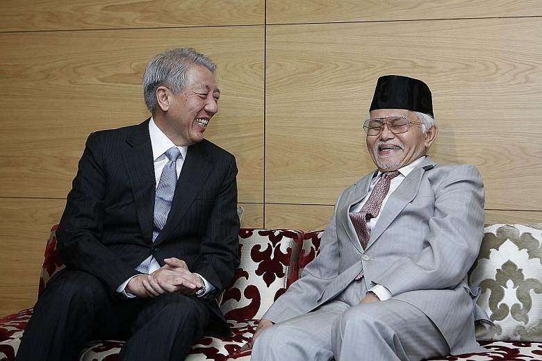 Deputy Prime Minister Teo Chee Hean with Regional Islamic Da'wah Council of South-east Asia and the Pacific (Riseap) president Tun Pehin Sri Abdul Taib Mahmud at the 17th Riseap general assembly yesterday.