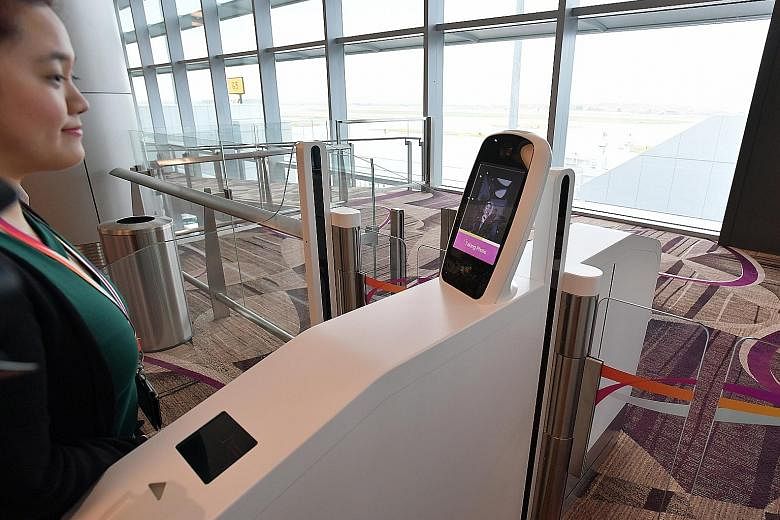 A dual facial and thumbprint biometric recognition system at Changi Airport's new Terminal 4. The Government is exploring the use of biometric technologies for identification and authentication, which are easy to use for the elderly, the young and th