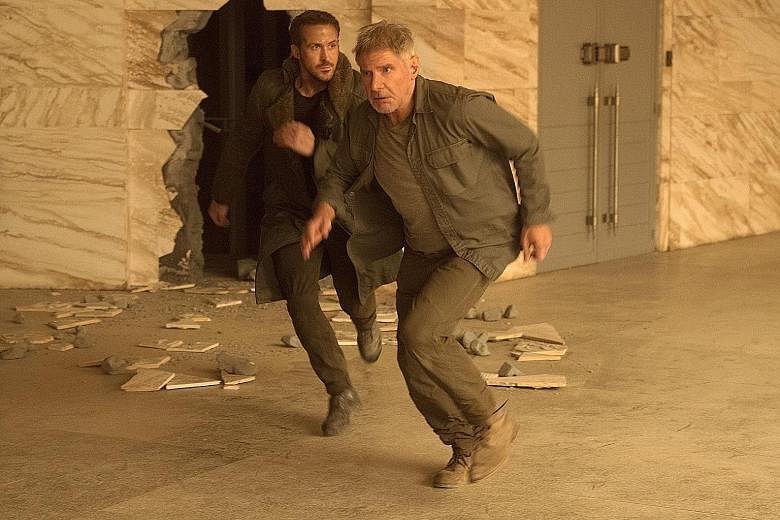 Blade Runner 2049, the sequel to the 1982 neo-noir fantasy about androids that look just like human beings, stars Ryan Gosling (far left) and Harrison Ford (left).