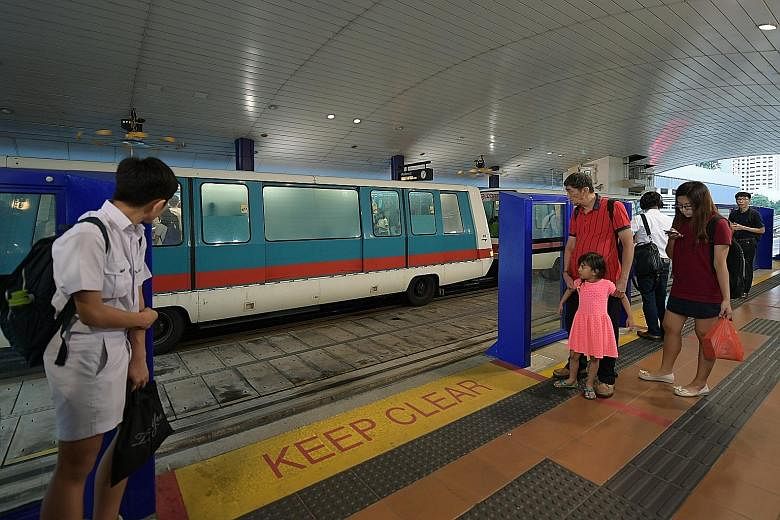 Safety barriers at the Bukit Panjang LRT station. Such barriers have been installed at the platforms of all stations on the Bukit Panjang LRT line, to prevent commuters from falling onto the tracks.