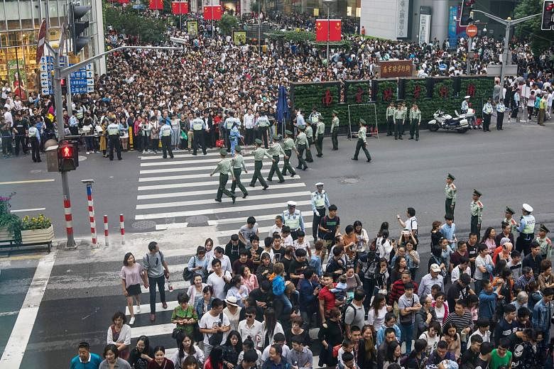 Police in Shanghai taking steps to control the large crowds yesterday. South Korea did not make the top 20 destinations for over six million users of the leading travel website Ctrip, who were travelling abroad during China's "Golden Week" holiday. T