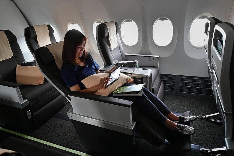 SilkAir staff member Nicole Lew, 38, in the business class section of the new Boeing 737 Max 8 plane.