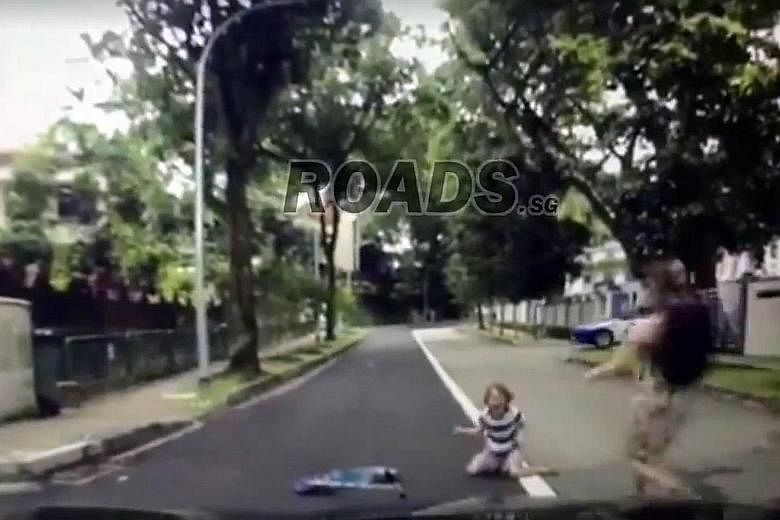 A series of screengrabs from the dashcam footage, posted on Facebook, that shows the boy being hit. The boy is seen crying on the road, while a woman runs towards him. He was taken conscious to National University Hospital.