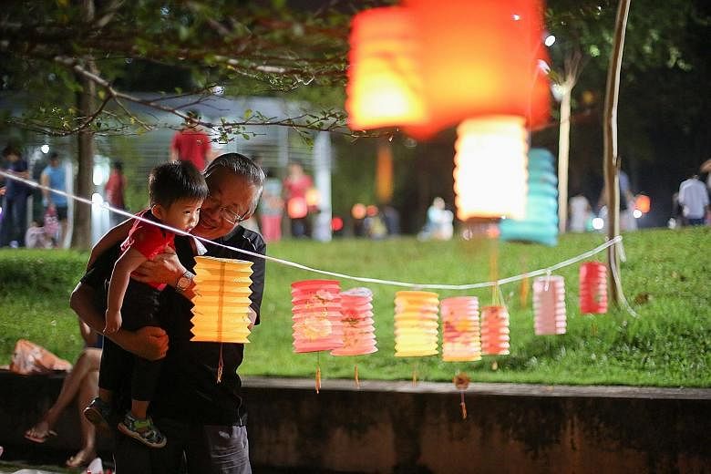 It was the Mid-Autumn Festival, and retiree William Koh, 66, took the opportunity to teach his 20-month-old grandson Barden Koh to count the lanterns hanging from a rope. At Bishan-Ang Mo Kio Park last night, families were out, armed with colourful l