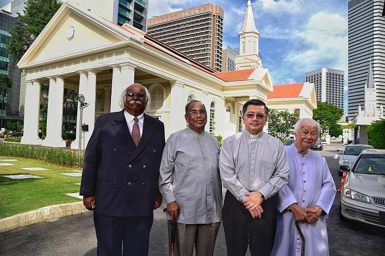 The cathedral in the 1910s. Constructed between 1843 and 1847, it is Singapore's oldest Catholic place of worship. It was gazetted as a national monument in 1973. Doing God's work are (from left) volunteer Alexander Charles Louis; Father Adrian Antho