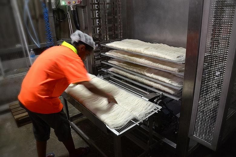 According to People Bee Hoon Factory director Desmond Goh (above), only two workers are needed for the bee hoon folding process with the help of the machine developed by ITE. The manual process originally required 10 workers.