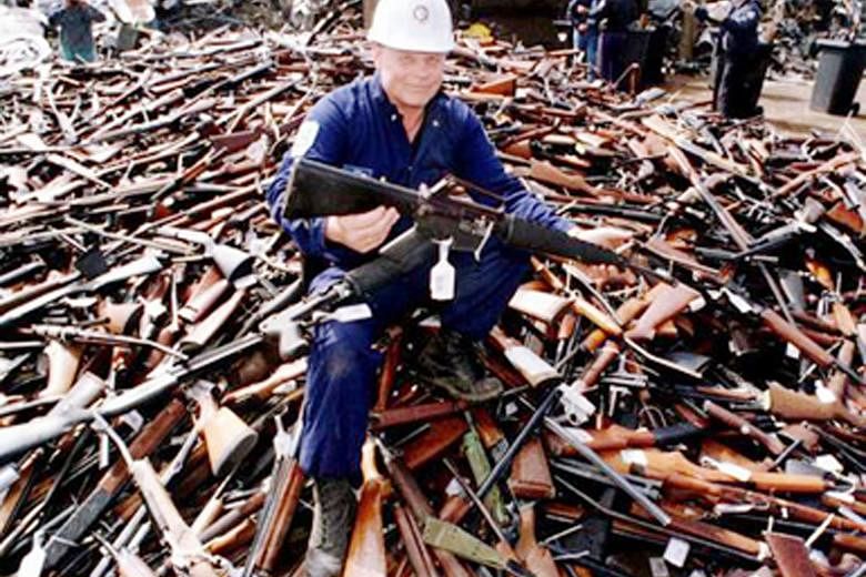 A 1996 photo taken in Melbourne of a pile of guns handed in after Australia banned automatic and semi-automatic weapons.