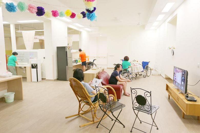 The interior of one of Ren Ci Ang Mo Kio's "households", which has its own living and dining areas, kitchenette and bedrooms, and resembles a Housing Board flat. Newly built nursing homes like Ren Ci Ang Mo Kio, offering more humane ways of living, a
