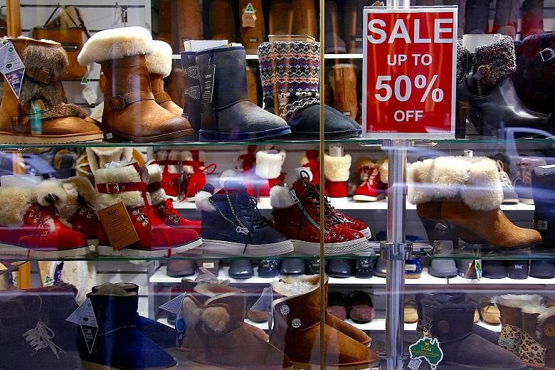 A store selling boots in central Sydney. Australian retailers have suffered their worst decline in sales since early 2013 as debt-laden consumers tighten their purse strings, slashing spending on food, furniture and clothing - an outcome that bodes p