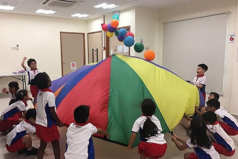Nurture Kids sessions are conducted on each pre-school's premises. Led by expert instructors, children learn fundamental movement skills like dodging and leaping over obstacles and throwing and catching balls (above). Nutrition workshops (below) invo