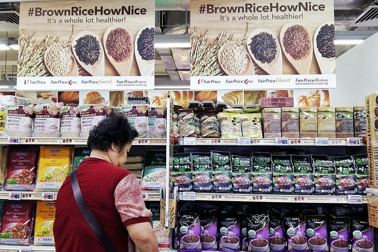 The brown rice bay at FairPrice in Bedok North. The supermarket chain is selling white and brown rice under its housebrands at the same price till Oct 18 in a move to support the national drive to fight diabetes. Other chains, such as Cold Storage an