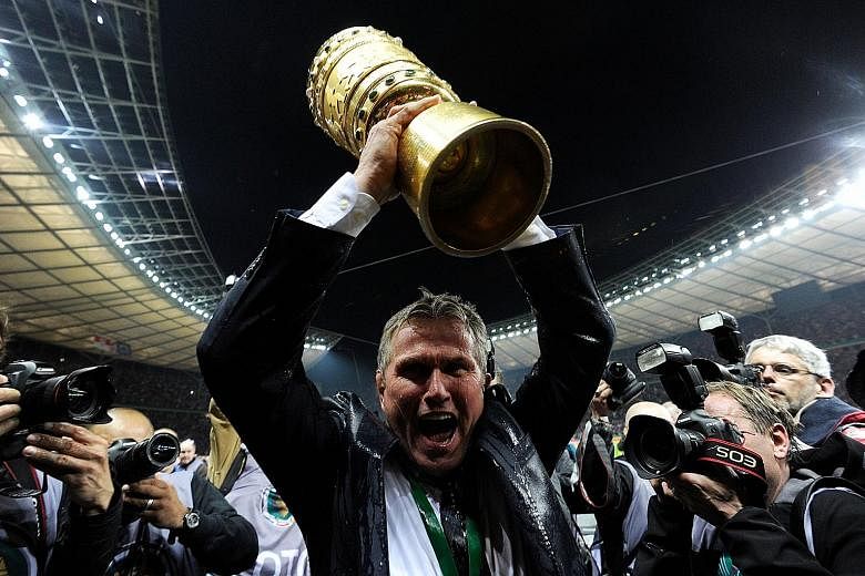 Jupp Heynckes lifting the German Cup in 2013, the year Bayern Munich won the treble. Now 72, the German is tipped for a fourth spell at the club.