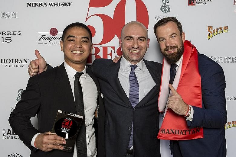 (From left) Cedric Mendoza, head bartender at Manhattan cocktail bar in Singapore, which was named the Best Bar in Asia; Mr Matthew Magliocco, global sales director at Michter's Distillery, which sponsored that title; and Manhattan's bar manager Phil