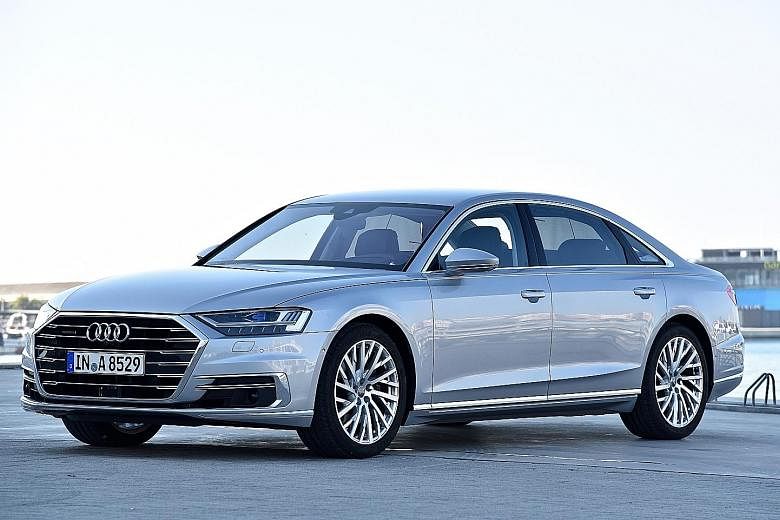 Audi's latest flagship A8 is bigger and smoother, gliding like a yacht over calm waters. Check out its legroom (below).