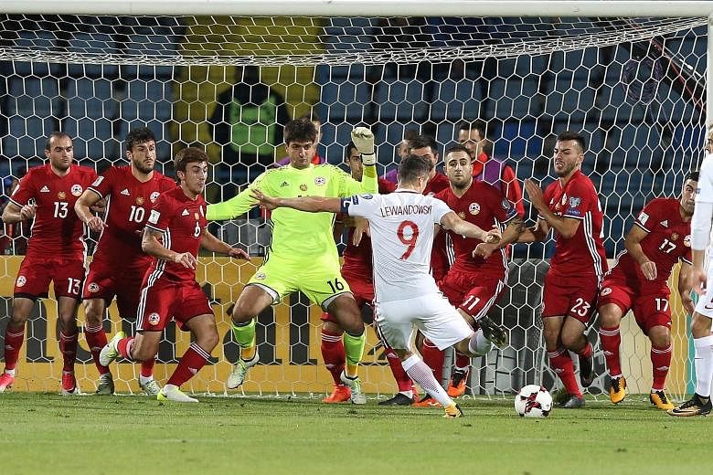 Striker Robert Lewandowski blasting home an indirect free kick in the penalty box in the 25th minute as Poland hammered Armenia 6-1 on Thursday to leave them on the brink of qualification for next year's World Cup Finals in Russia. The Bayern Munich 