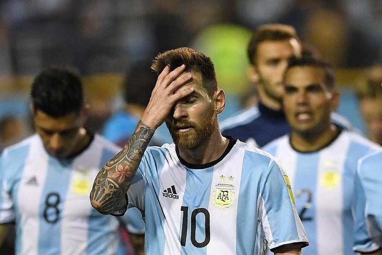 A disappointed Lionel Messi, who hit the post in the second half against Peru, trooping off with his men after their match in Buenos Aires. Argentina have not scored from open play for more than 450 minutes.