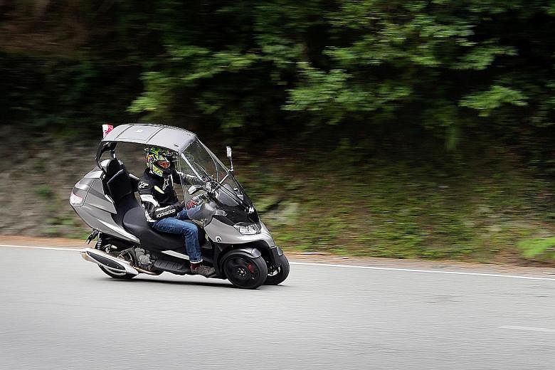 The roof and wiper-equipped windscreen make the AD3 the right bike for wet weather.