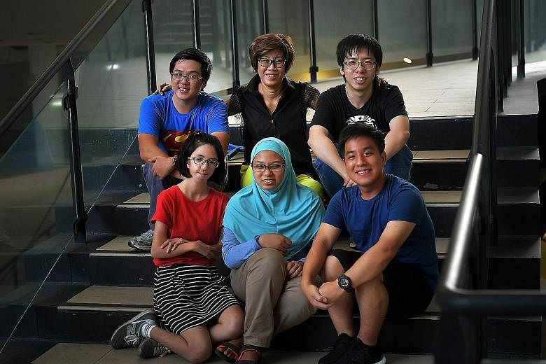 Mrs Tan Shook Wah co-founded The Smart Think, in February this year. The start-up has pioneered a new technology to make lighter, safer and cheaper body armour and helmets. Mrs Tan Shook Wah with some recipients of the Dare to Dream scholarship: (ant