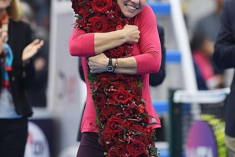 A dream come true for Simona Halep - the first Romanian to reach the highest rung in WTA history - as she hugs a giant flower arrangement in the shape of a figure '1' after making the final of the China Open.