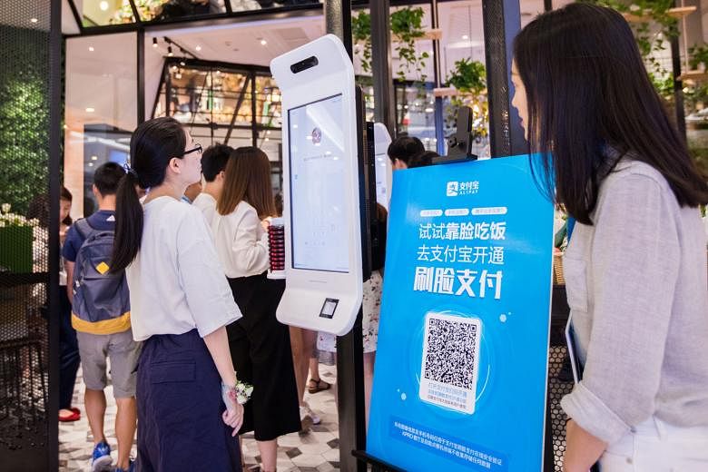 A customer trying out Alipay's facial recognition payment solution "Smile to Pay" at a KFC restaurant in Hangzhou, Zhejiang province, last month. The public's growing exposure to the technology in various fields also means facial recognition is likel