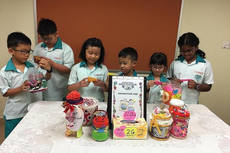 Concord Primary School pupils reading notes from their gratitude jars, which are part of the Gratitude Project which the school introduced last year.