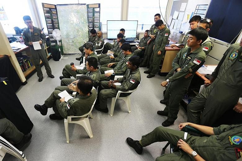 Pilots involved in Exercise Wallaby at a safety briefing. Exercise Wallaby, which is in its 27th year, features a difficult and expansive terrain and harsh weather conditions meant to train soldiers to be resilient and to test the capabilities of the
